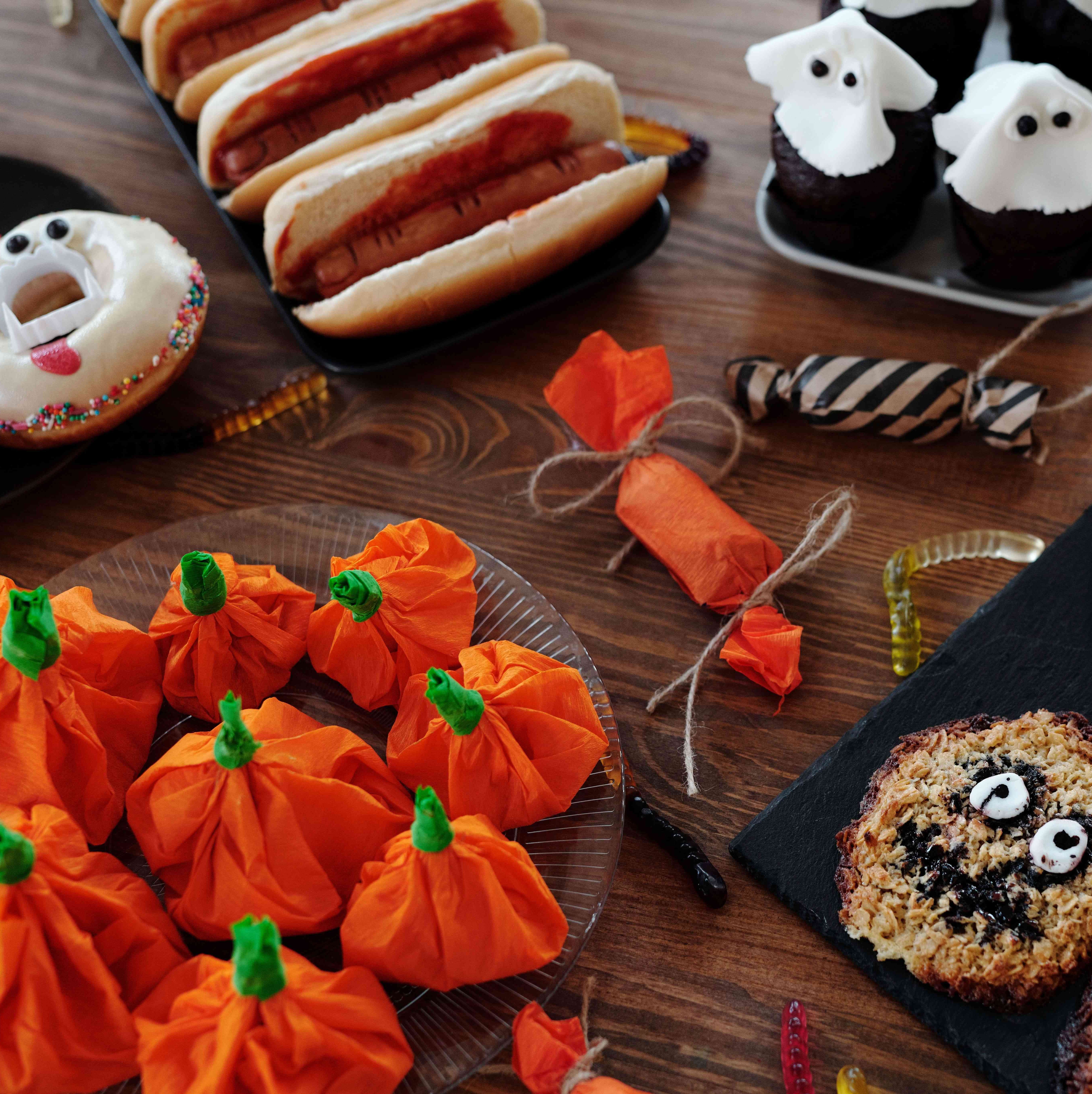 Halloween-themed snacks, vampire donuts, ghost cupcakes and pumpkin candies