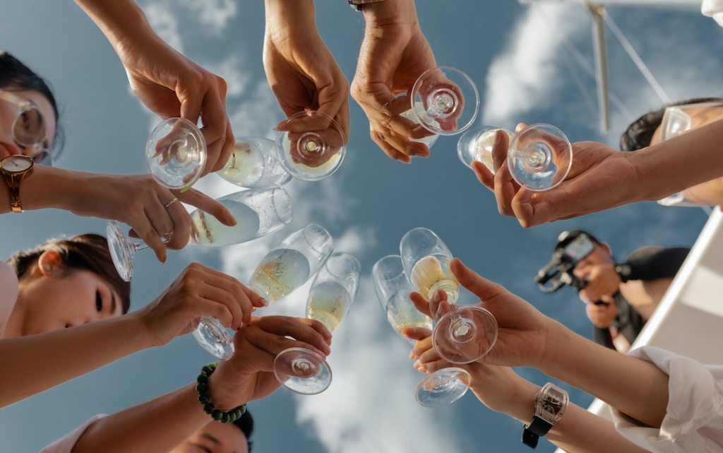 A group of employees clinking glasses with champagne