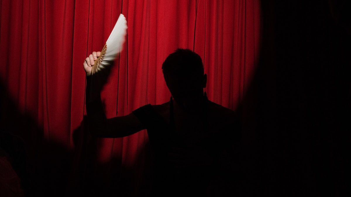A magician performing on a stage