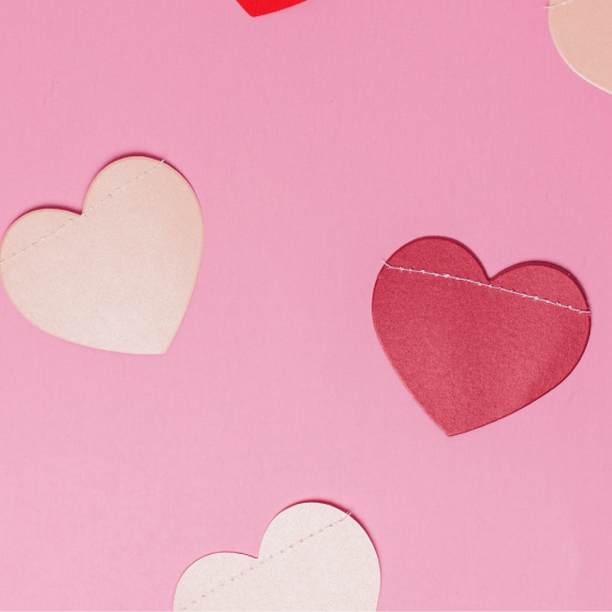 cut-out paper hearts on a table
