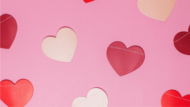 cut-out paper hearts on a table